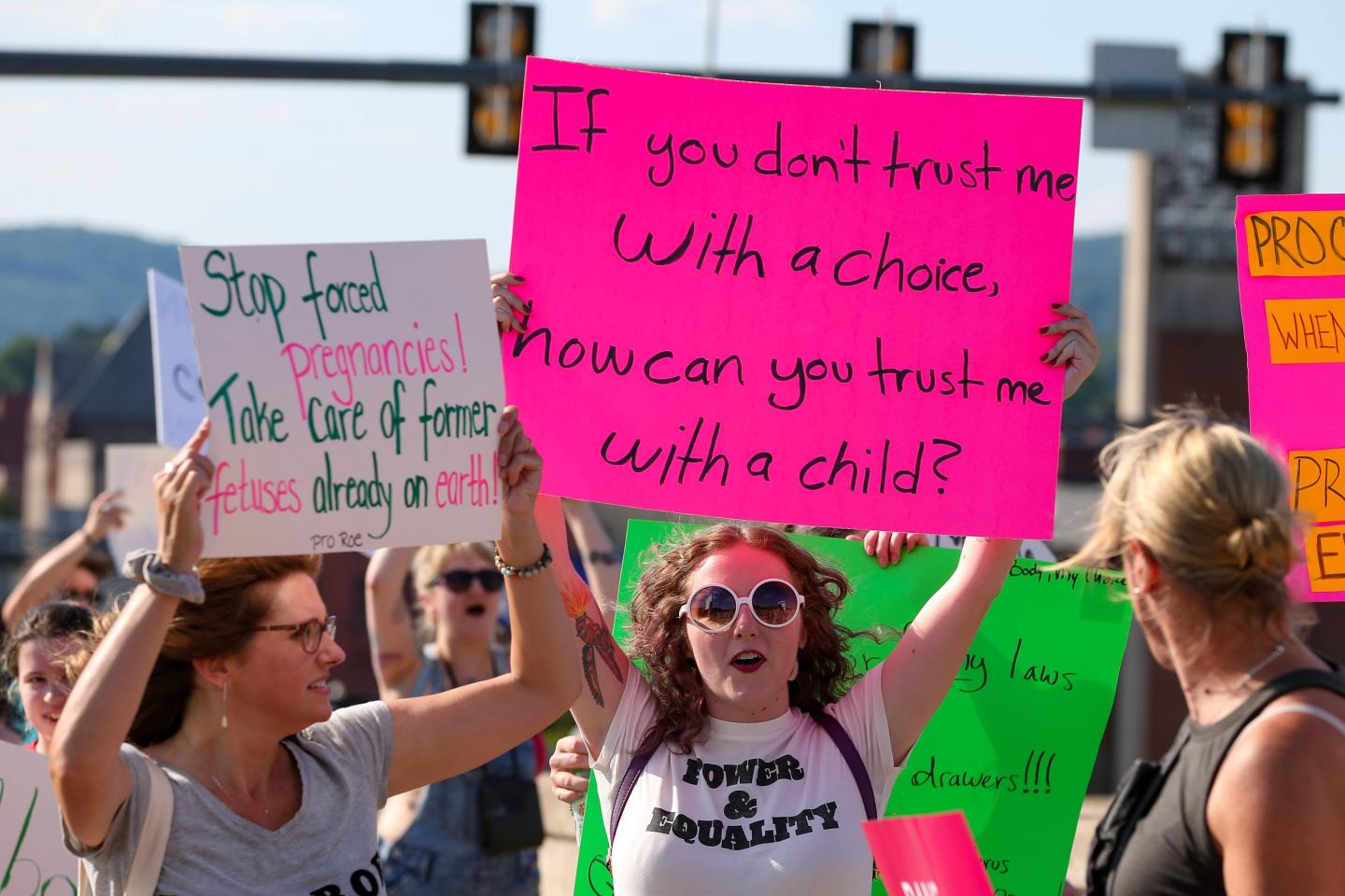 Protesters hold placards supporting abortion rights.