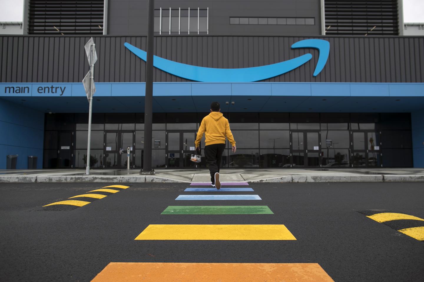 An employee enters an Amazon fulfillment center in Australia
