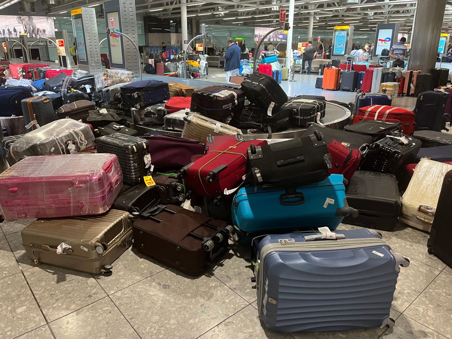 Suitcases are seen uncollected at Heathrow's Terminal Three bagage reclaim