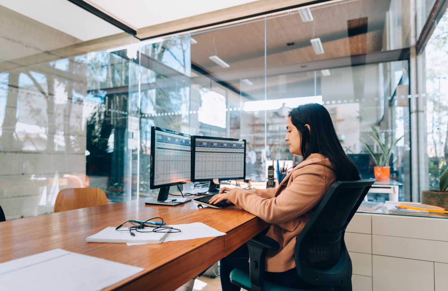 Businesswoman at the office typing on a computer