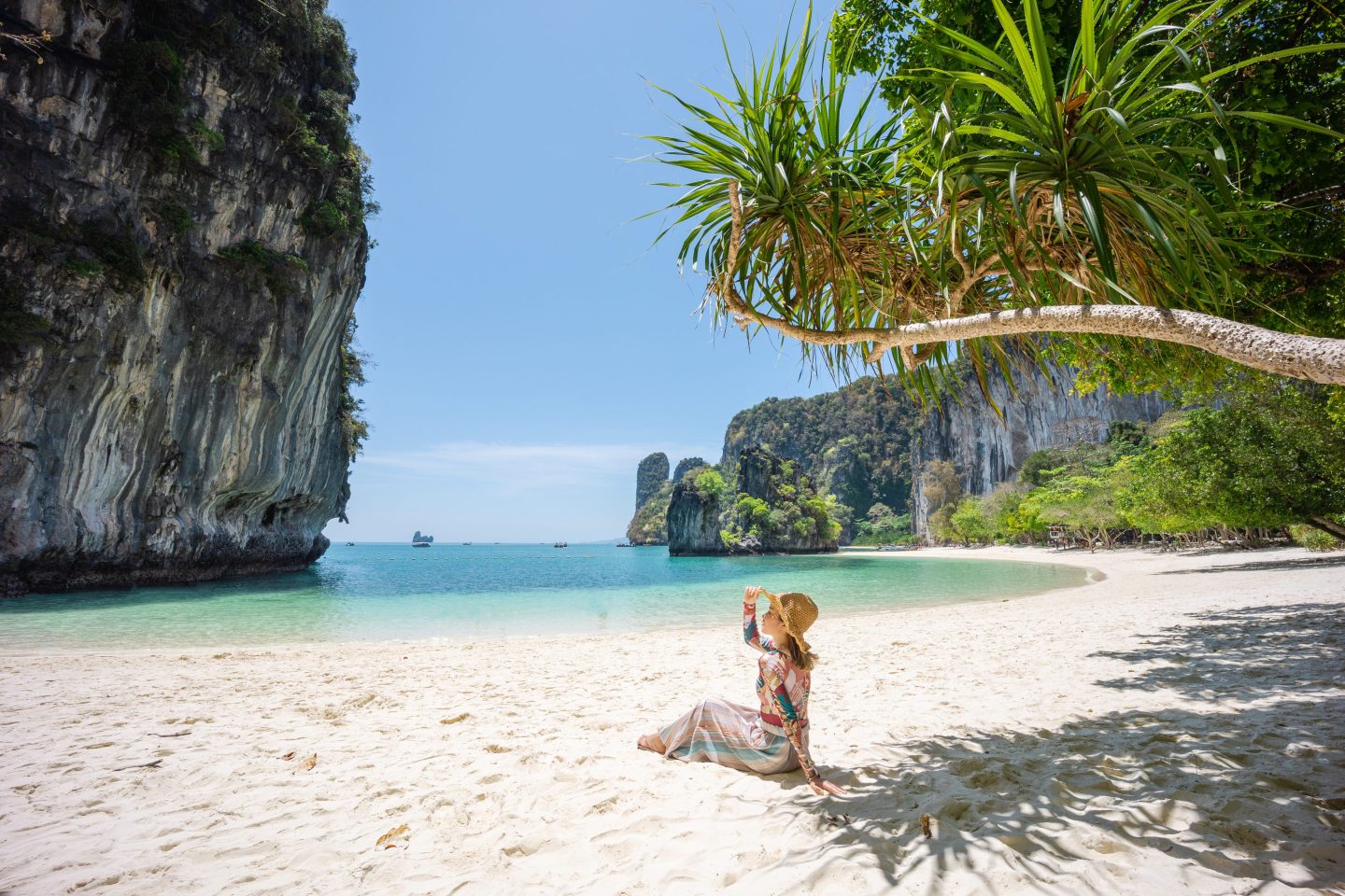 A tourist girl on Koh Hong beach in the morning clear sky, Krabi province, Thailand.