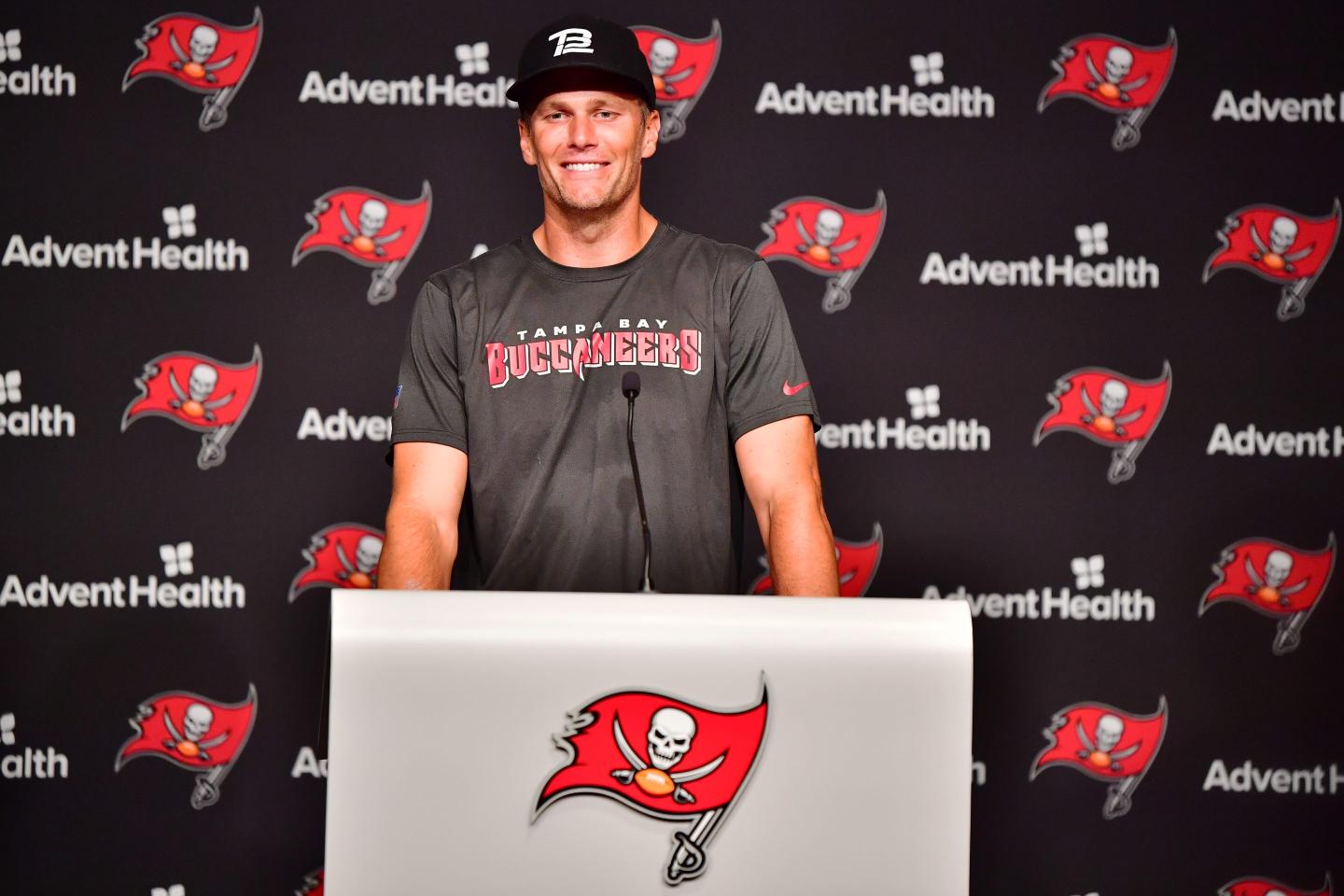 Tom Brady standing at a podium