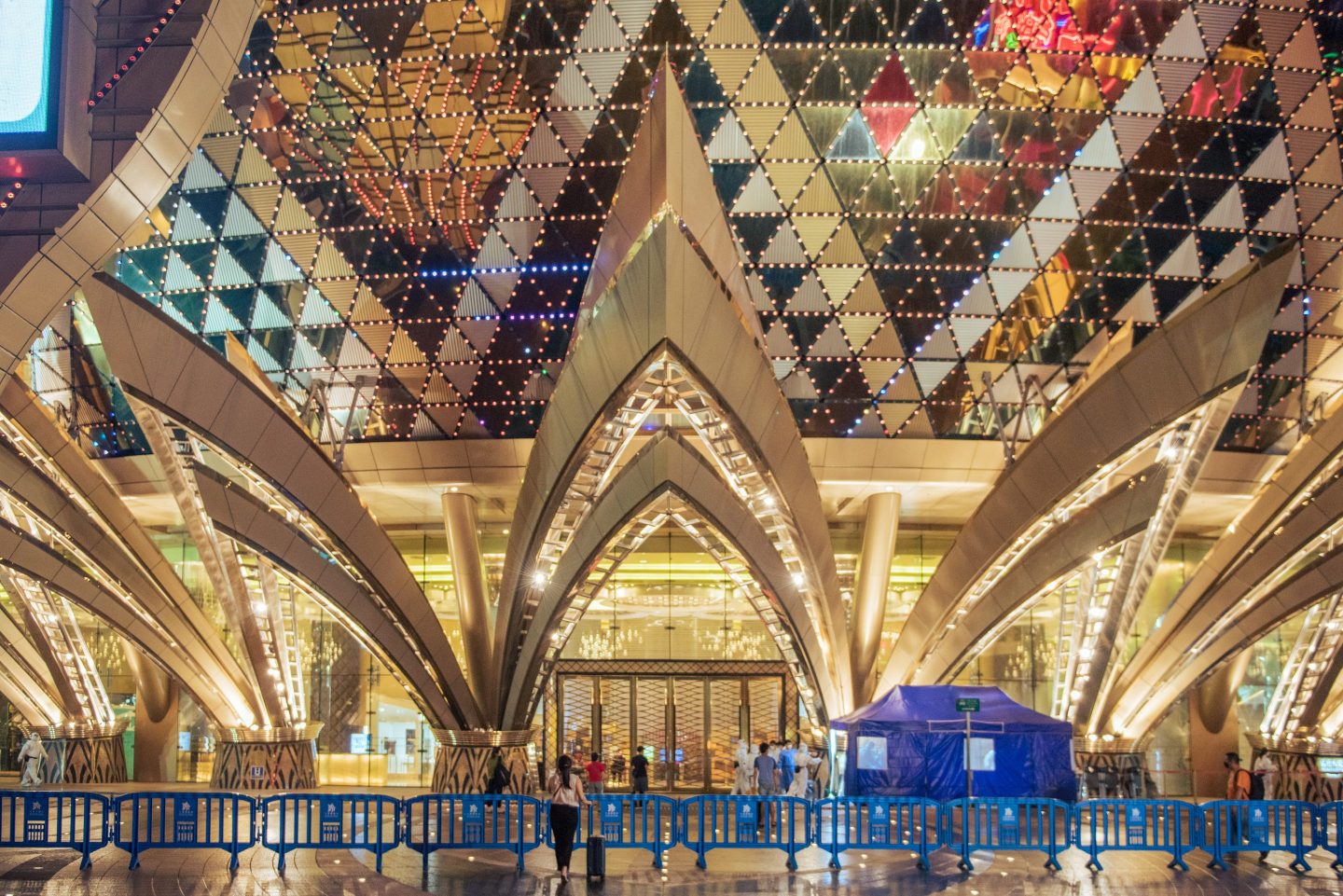 A blue plastic barrier seals off the entrance to Macau's Grand Lisboa hotel
