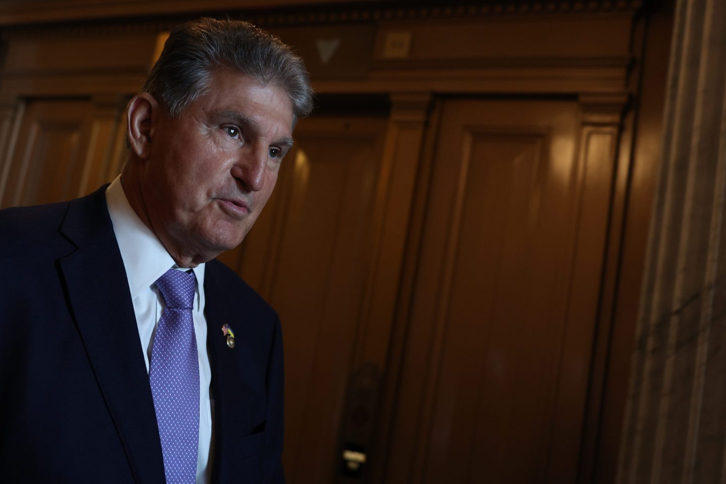 Sen. Joe Manchin (D-WV) walks out of the Senate Chambers in the U.S. Capitol on July 21, 2022 in Washington, DC.