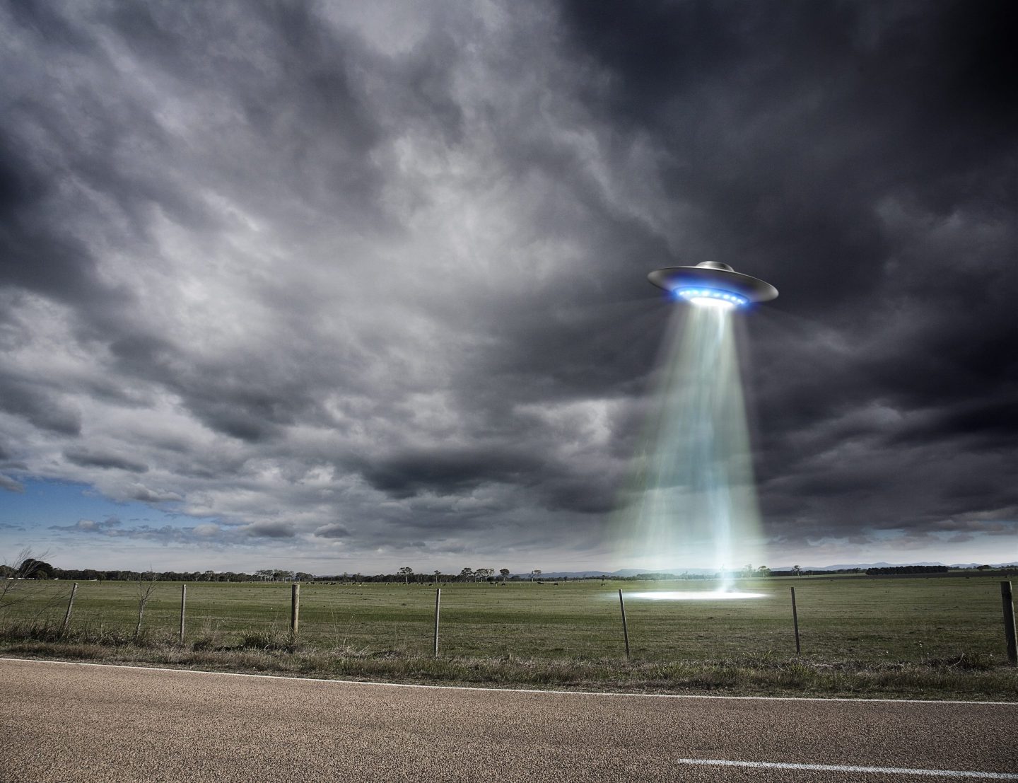 An illustration of a UFO over a field.
