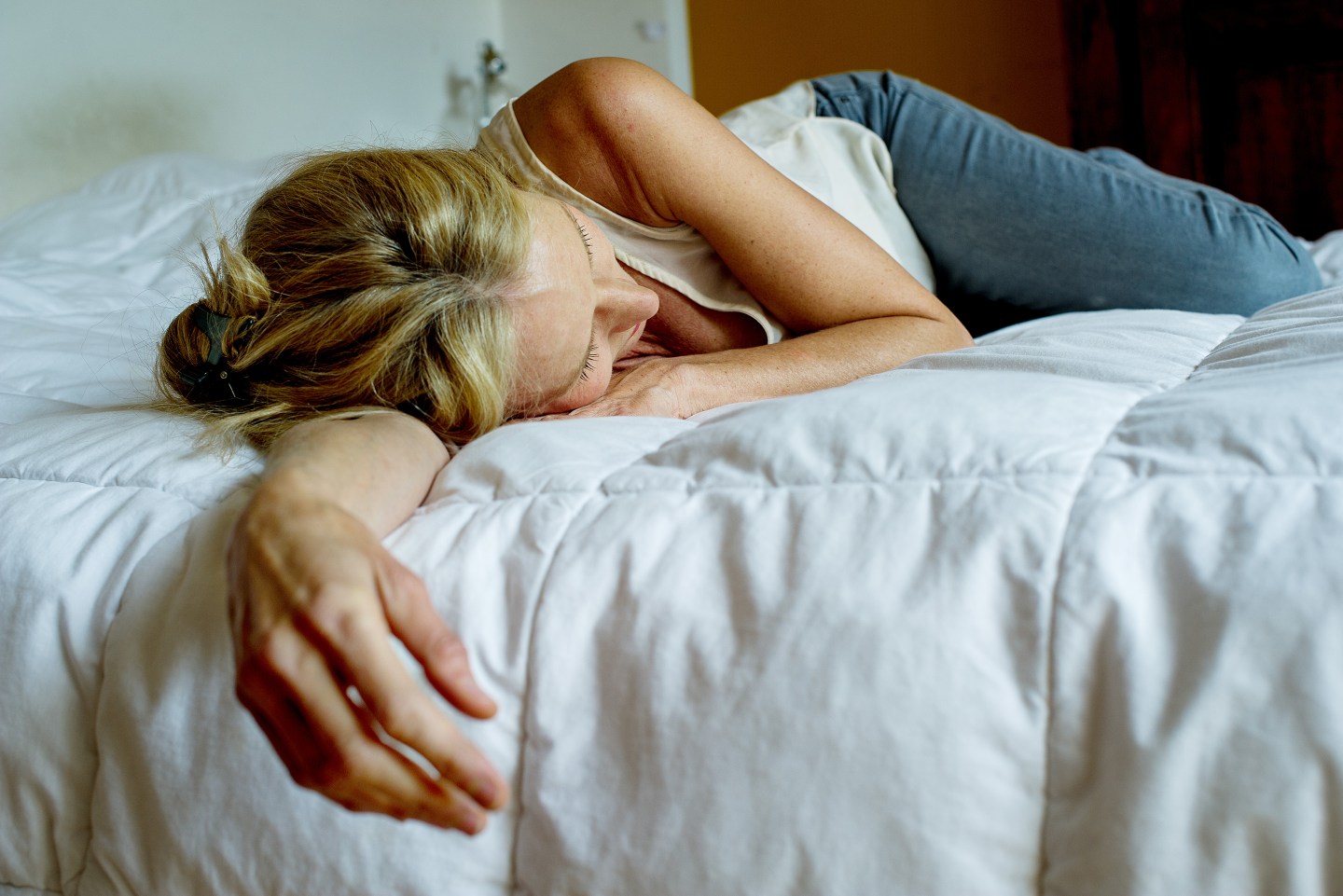 Woman lying down on bed
