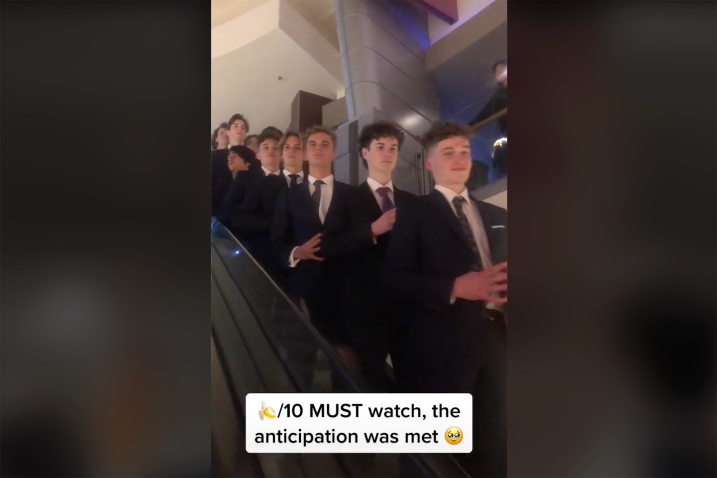 Tik Tok trend where large groups show up to the theater in suits.