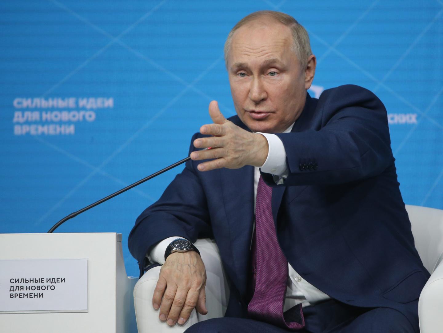 Russian President Vladimir Putin speaks at a conference.
