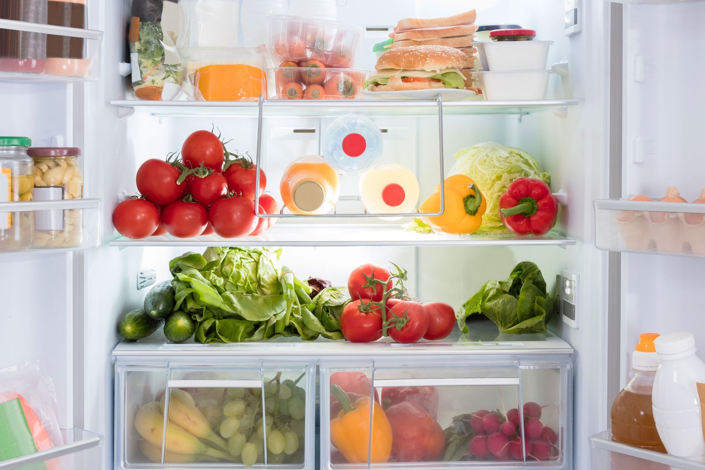 Open Refrigerator Filled With Fresh Fruits And Vegetable