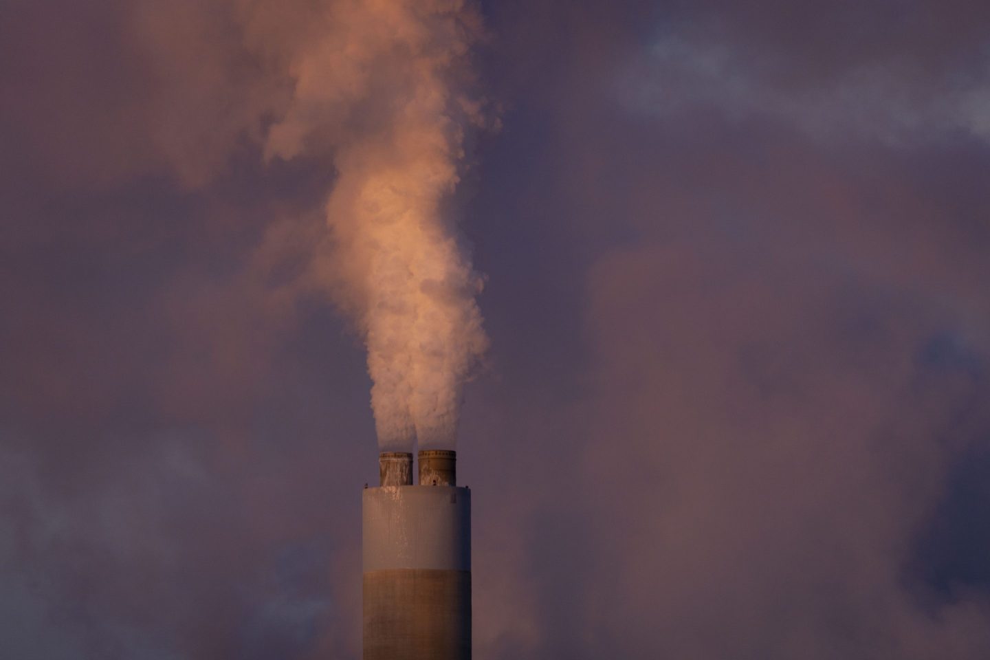 Carbon dioxide and other pollutants billows from a stack at PacifiCorp's coal-fired Naughton Power Plant, near where Bill Gates company, TerraPower plans to build an advanced, nontraditional nuclear reactor, Thursday, Jan. 13 in Kemmerer, Wyo.
