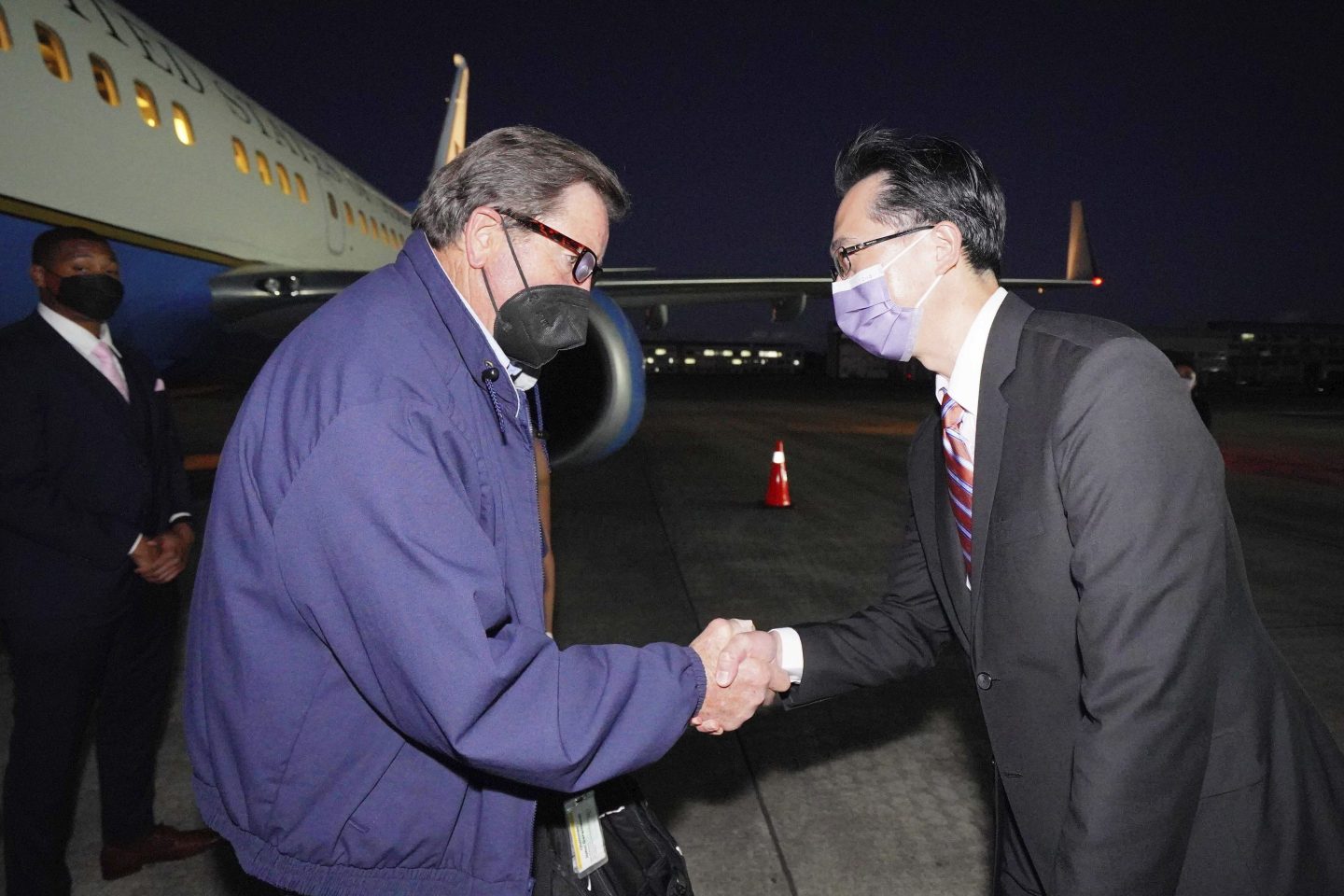 In this photo released by the Taiwan Ministry of Foreign Affairs, from left, U.S. Democratic House members John Garamendi shakes hands with Donald Yu-Tien Hsu, Director-General, dept. of North American Affairs, Taiwan's Ministry of Foreign Affairs after arriving on a U.S. government plane at Songshan airport in Taipei, Taiwan on Aug 14. The delegation of American lawmakers are visiting Taiwan just 12 days after a visit by U.S. House Speaker Nancy Pelosi that angered China.