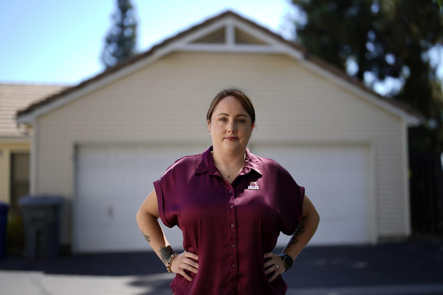 Kate Needham, a veteran who co-founded the nonprofit Armed Forces Housing Advocates, looks on in a housing complex Aug. 16 in San Diego. Needham's group supplies microgrants to military families in need, some of whom have resorted to food banks because their salaries do not cover such basics. “I don’t think civilians really understand — they might think we’re living in free housing and just having a great time, making lots of money. And that’s not the case at all.”