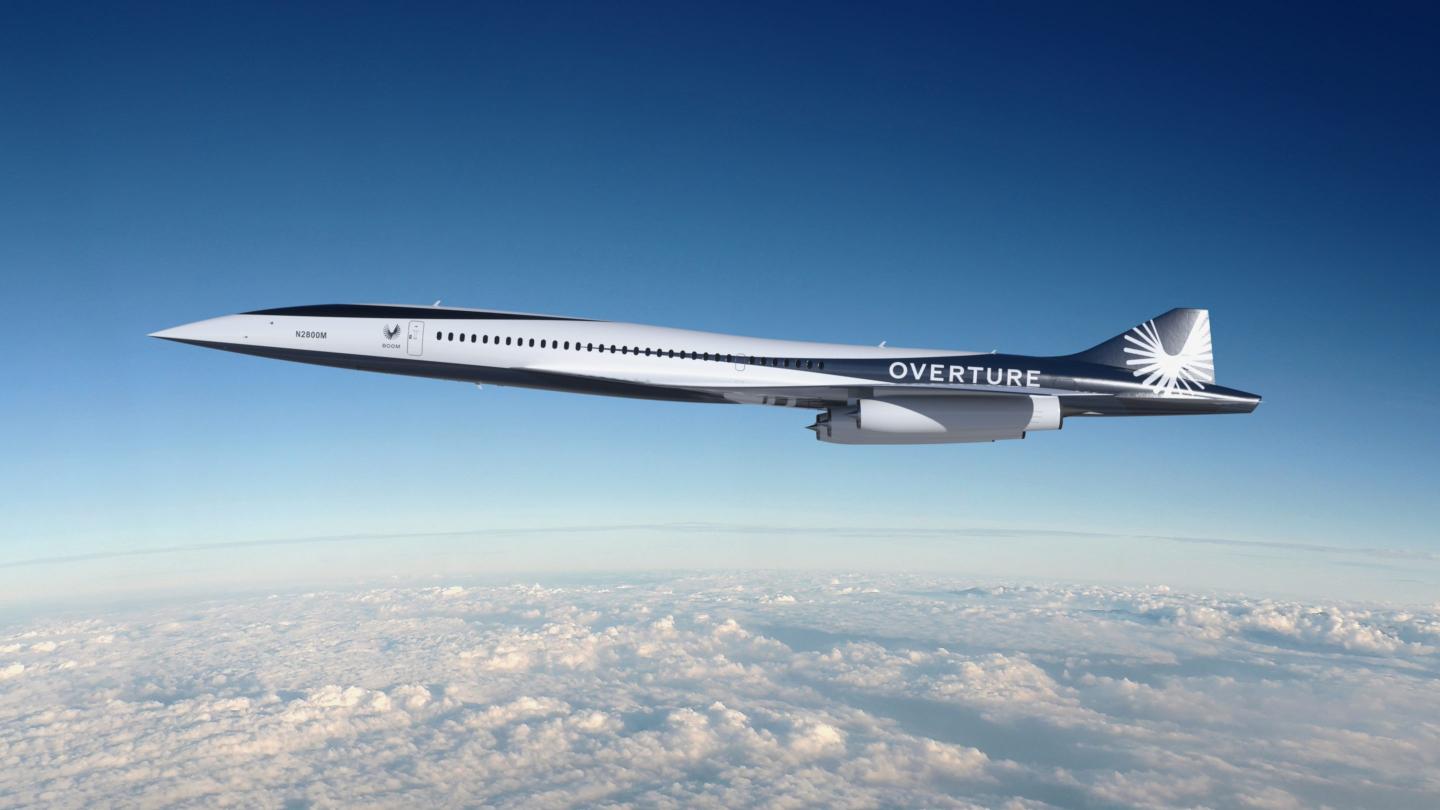 The image shows a mock-up of the Overture aircraft mid-flight.