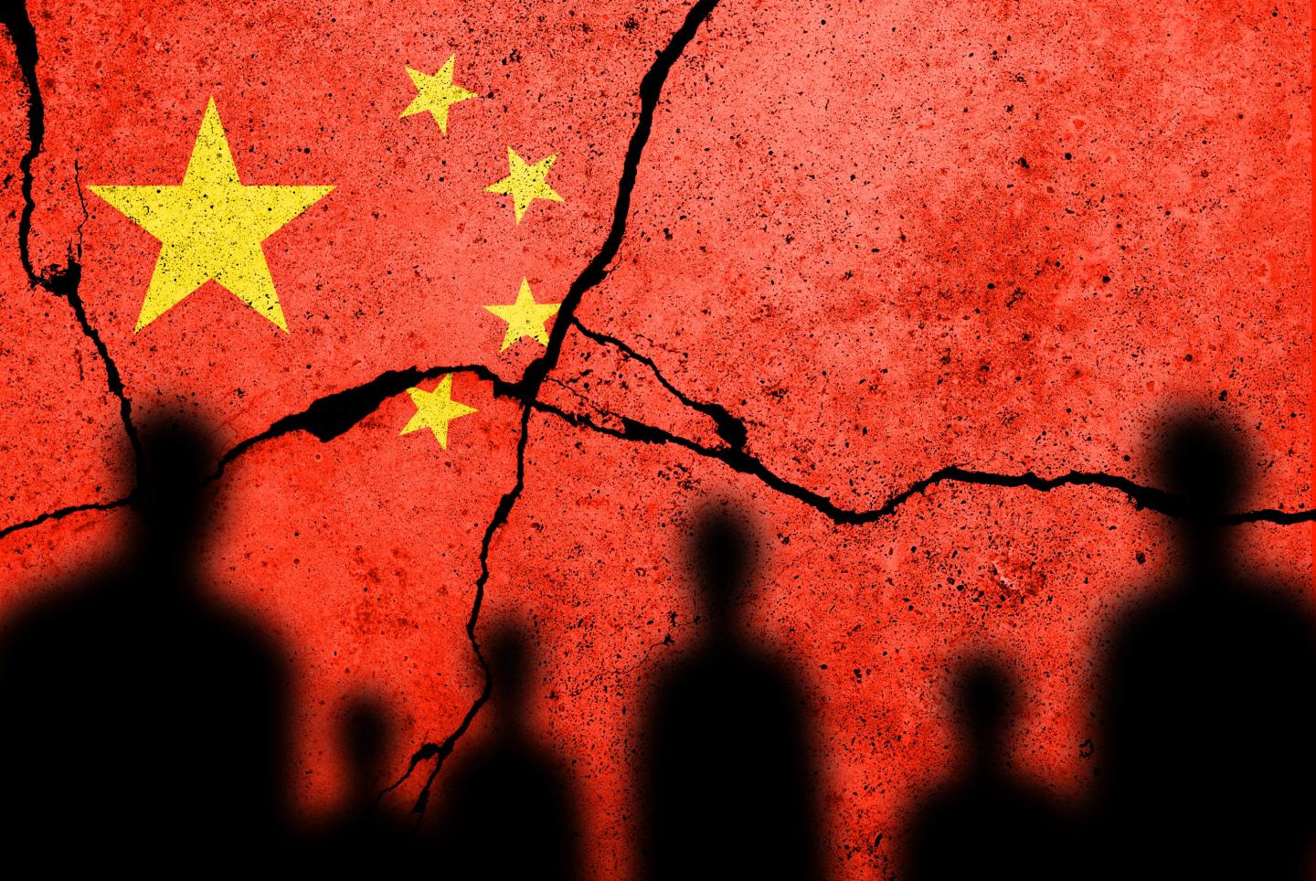 Flag of China with cracks in it.