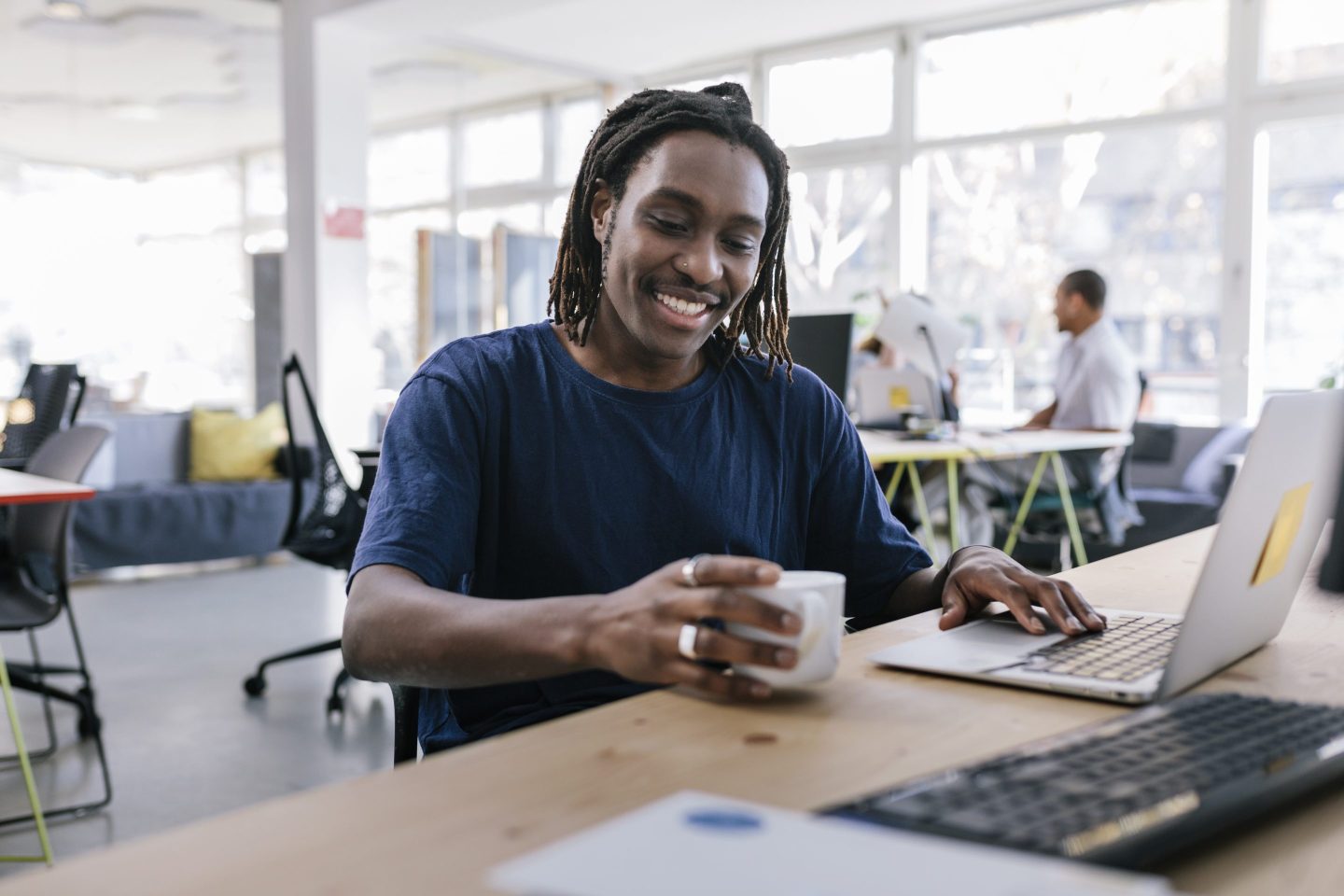 Smiling black businessman in casual office
