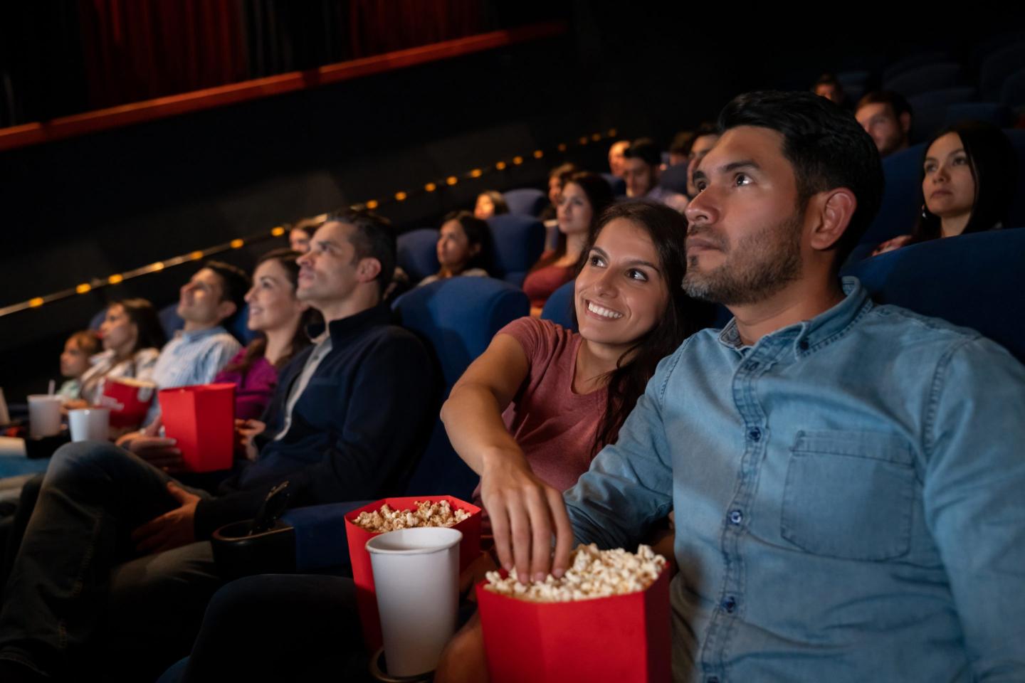 people eat popcorn at movies