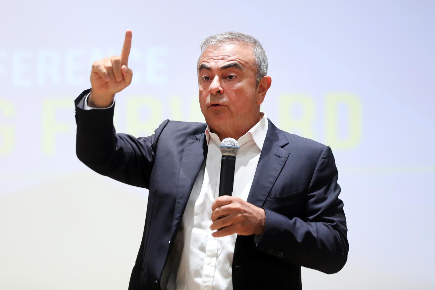 Carlos Ghosn, former Nissan chief executive officer, center, prepares to speak during a news conference at the Holy Spirit University of Kaslik (USEK) in Jounieh, Lebanon, on Tuesday, Sept. 29, 2020.