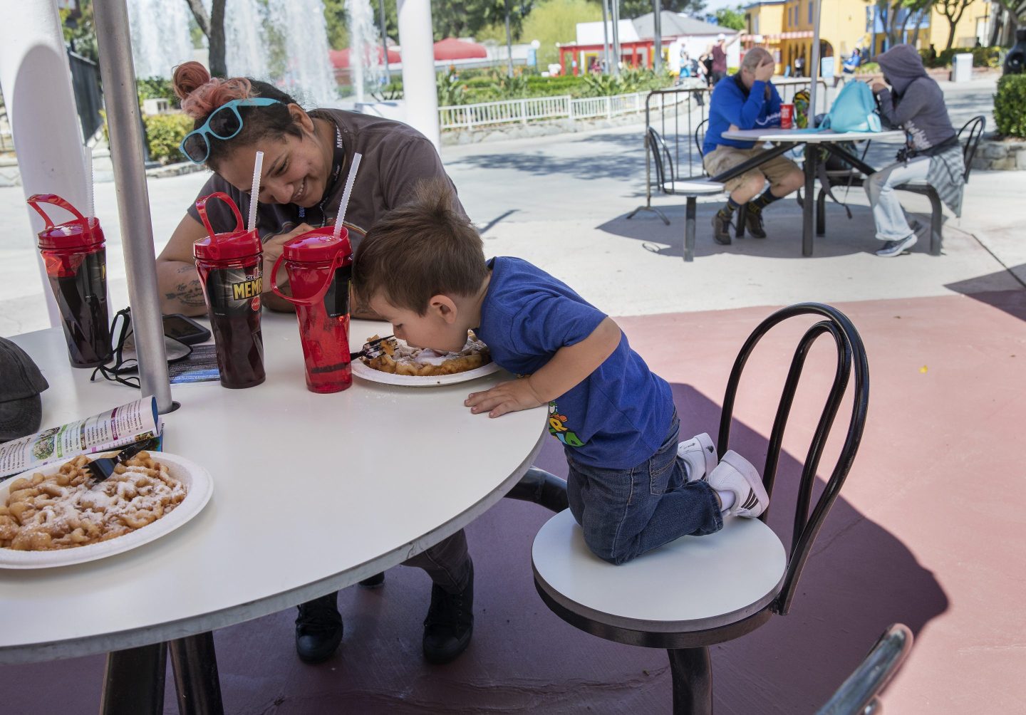 Boy eating at Six Flags