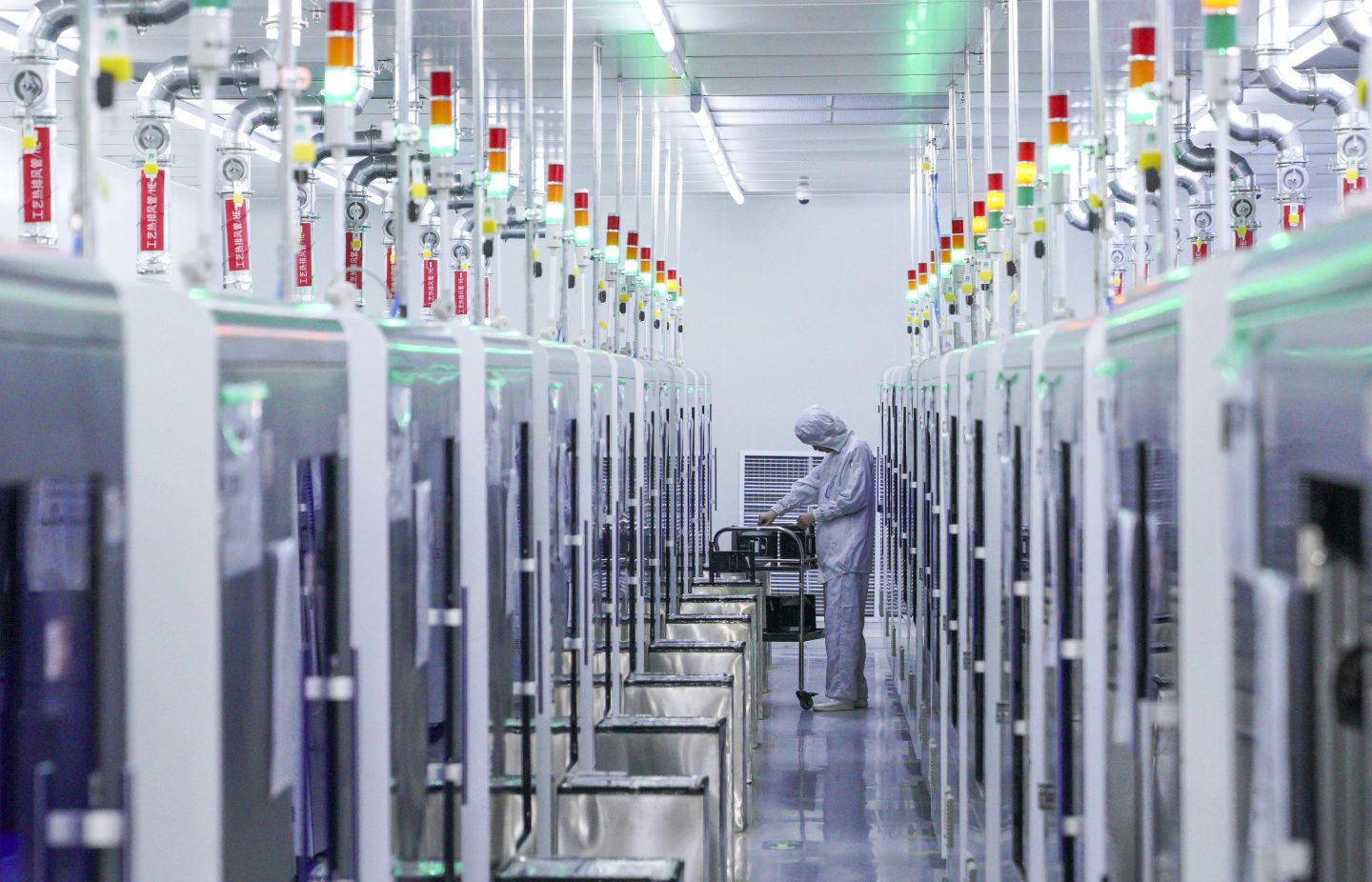 Photo of a worker at a semiconductor workshop in Nanchang, China, on January 26, 2022.