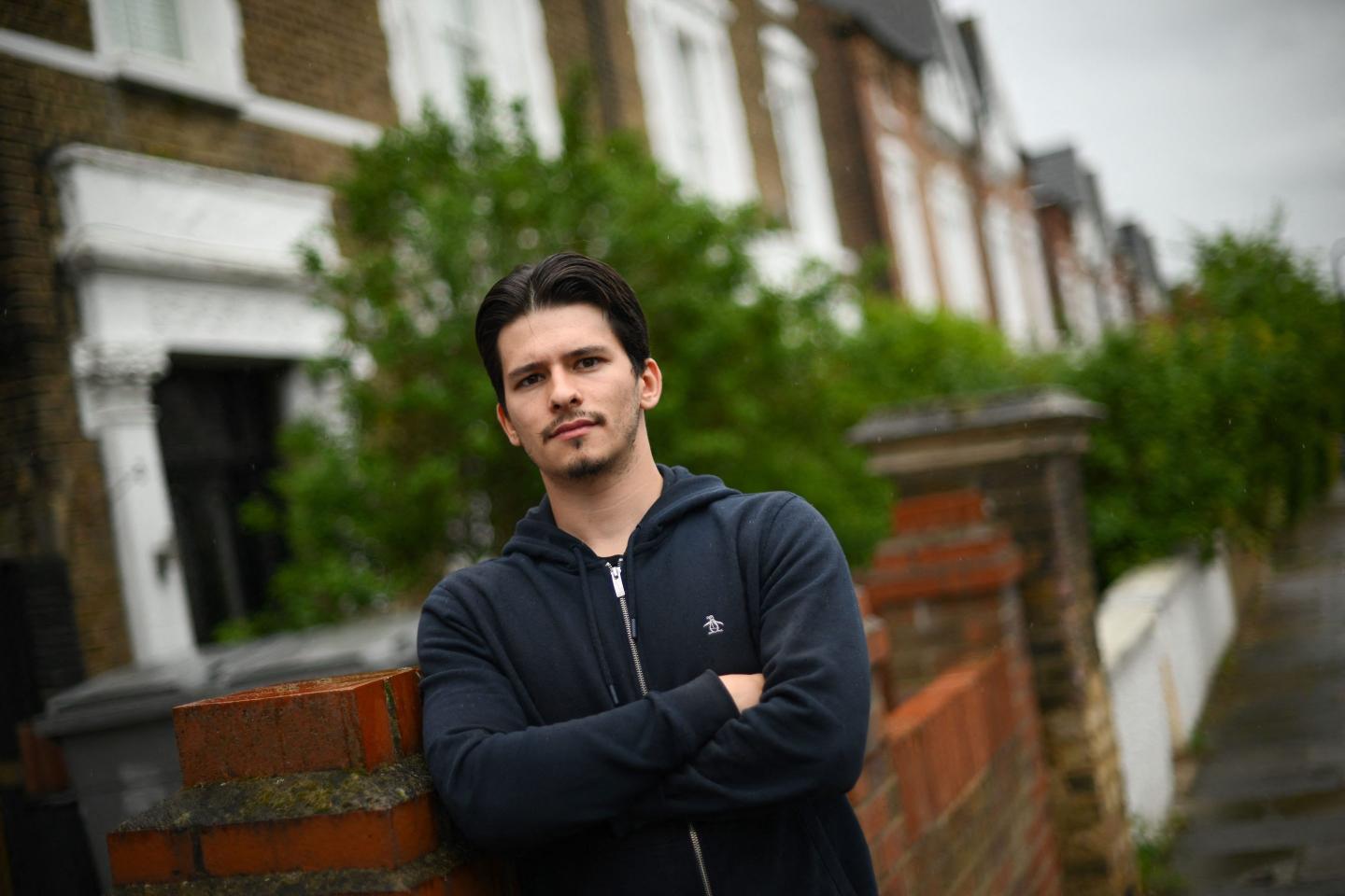 Twenty-five-year-old London student Zeno, with a student loans, poses for photographs, in north London, on May 11.