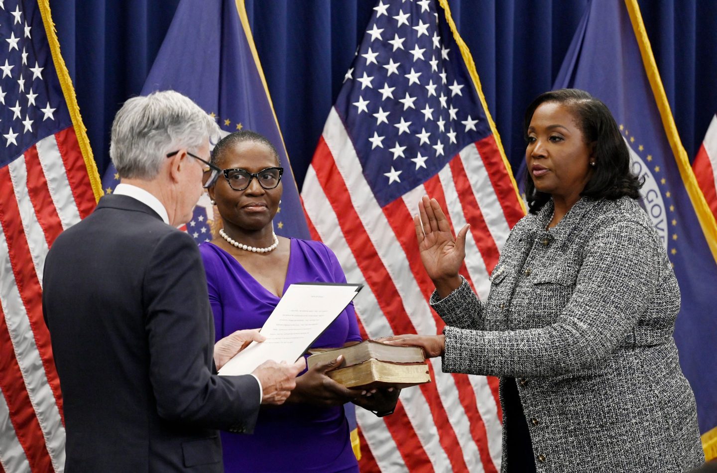 Lisa Cook (R) takes the oath of office as she is sworn-in to become a member of the Federal Reserve Board by Federal Reserve Board Chair Jerome Powell, at the Federal Reserve Building in Washington, D.C. on May 23, 2022.