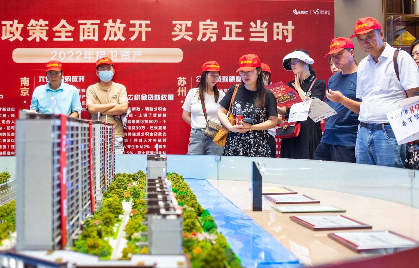 Potential homebuyers listen to a seminar on real estate in Haian, Jiangsu, China, on July 8, 2022.