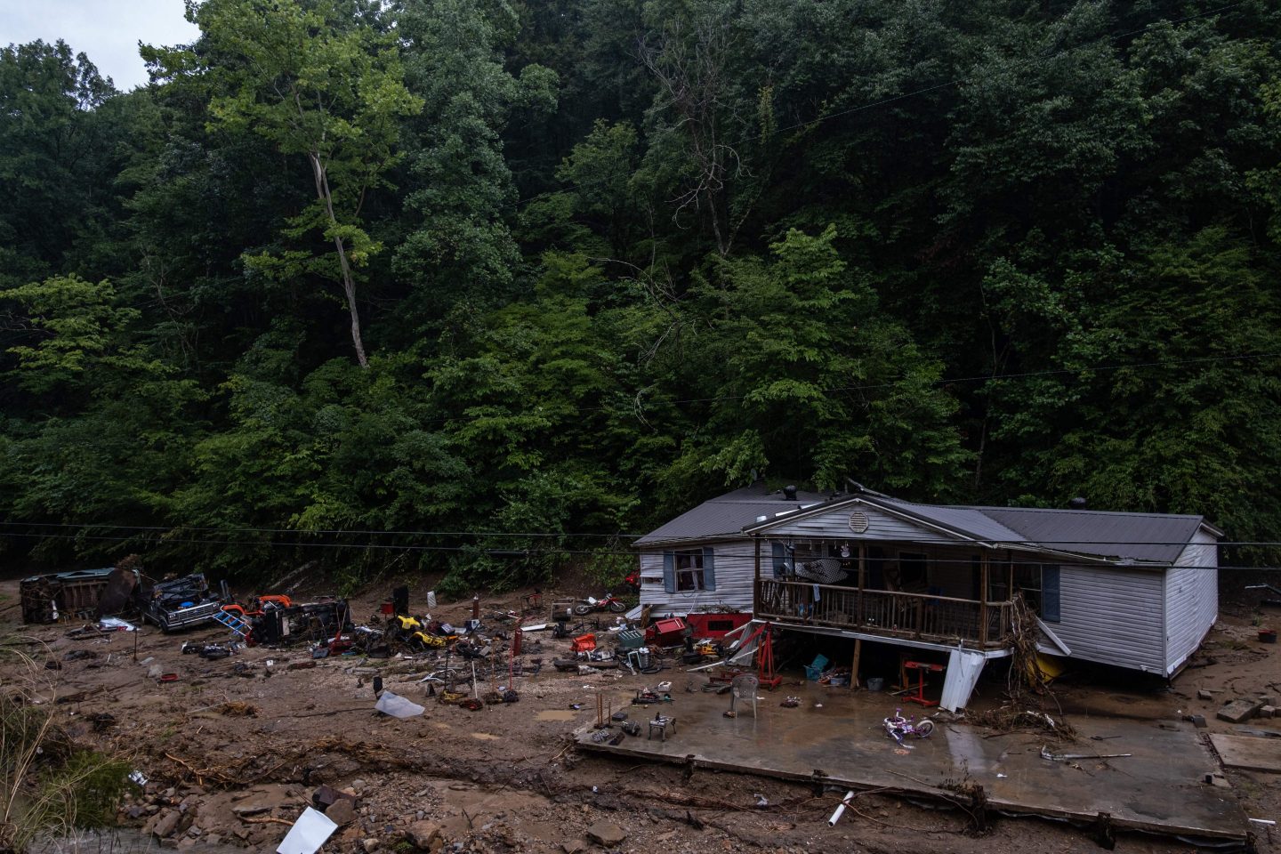 Debris surrounds a badly damaged home near Jackson, Kentucky, on July 31st after historic flooding swept through eastern Kentucky.