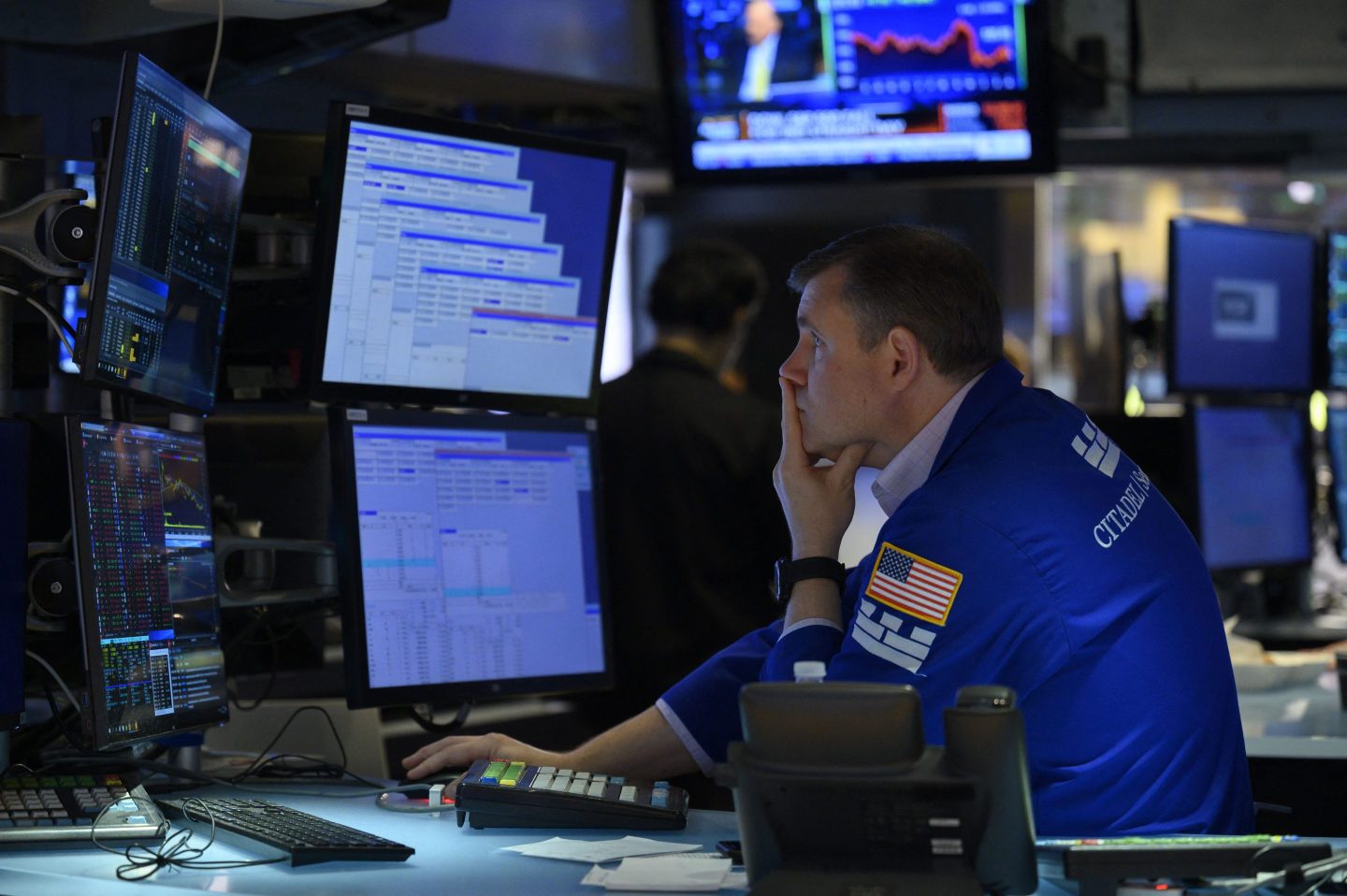 Stock trader stares at screen