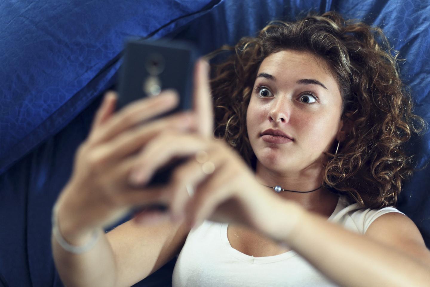 woman takes selfie