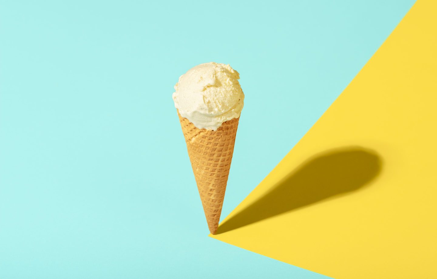 Ice Cream In A Waffle Cone With Vanilla, On Blue Pastel Background