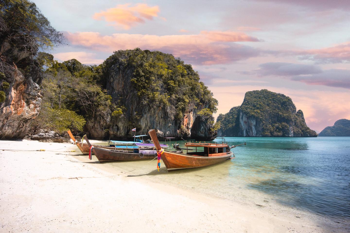 Long tail boats on a beach in Krabi, Thailand