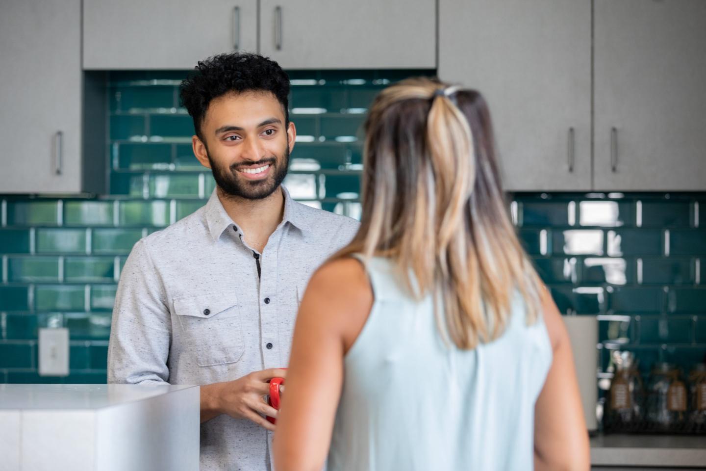 Man and women having a conversation at work
