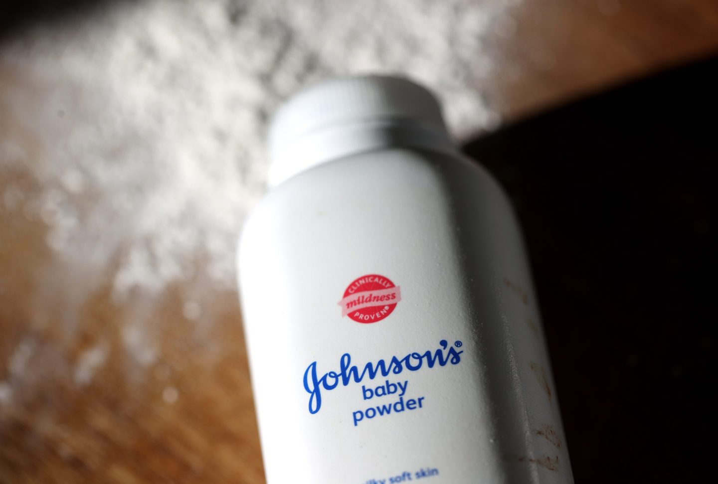 Johnson baby powder is displayed on a table.