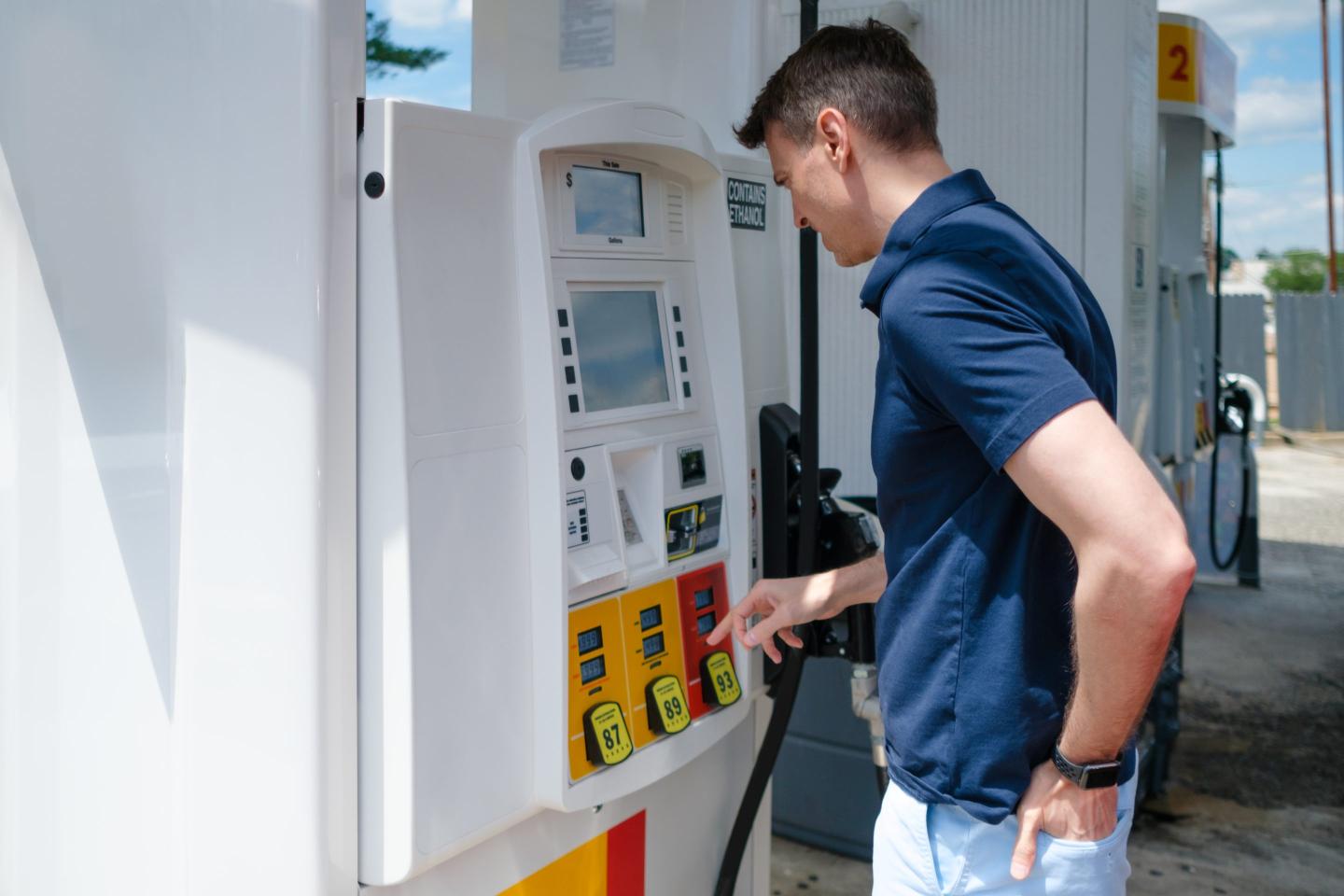 man paying for gas