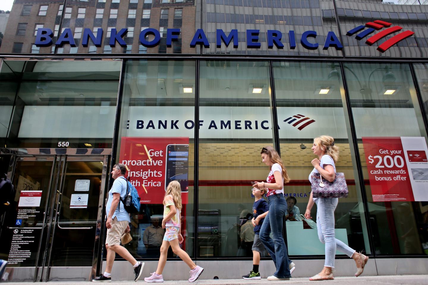 People walk near Bank of America branch