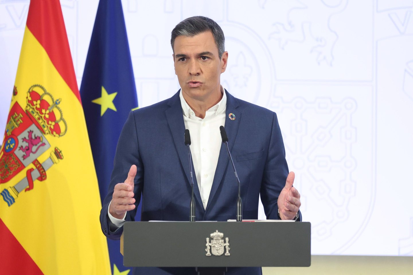 Pedro Sanchez speaks on stage