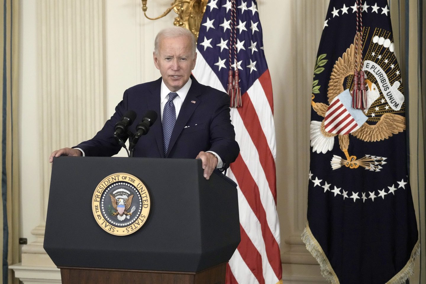 President Biden at a podium in the White House