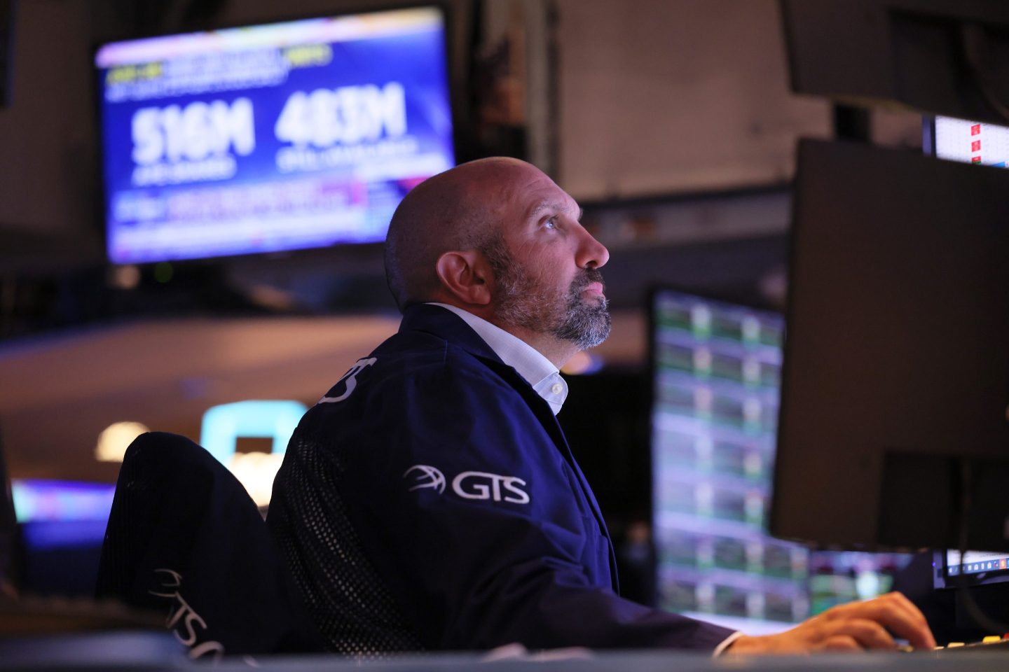 Traders work on the floor of the New York Stock Exchange during afternoon trading in August 2022