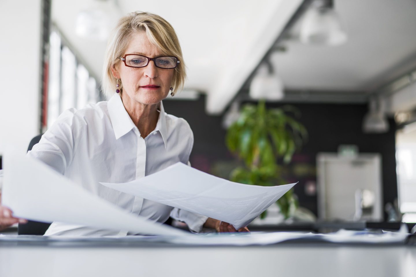 Businesswoman examining documents