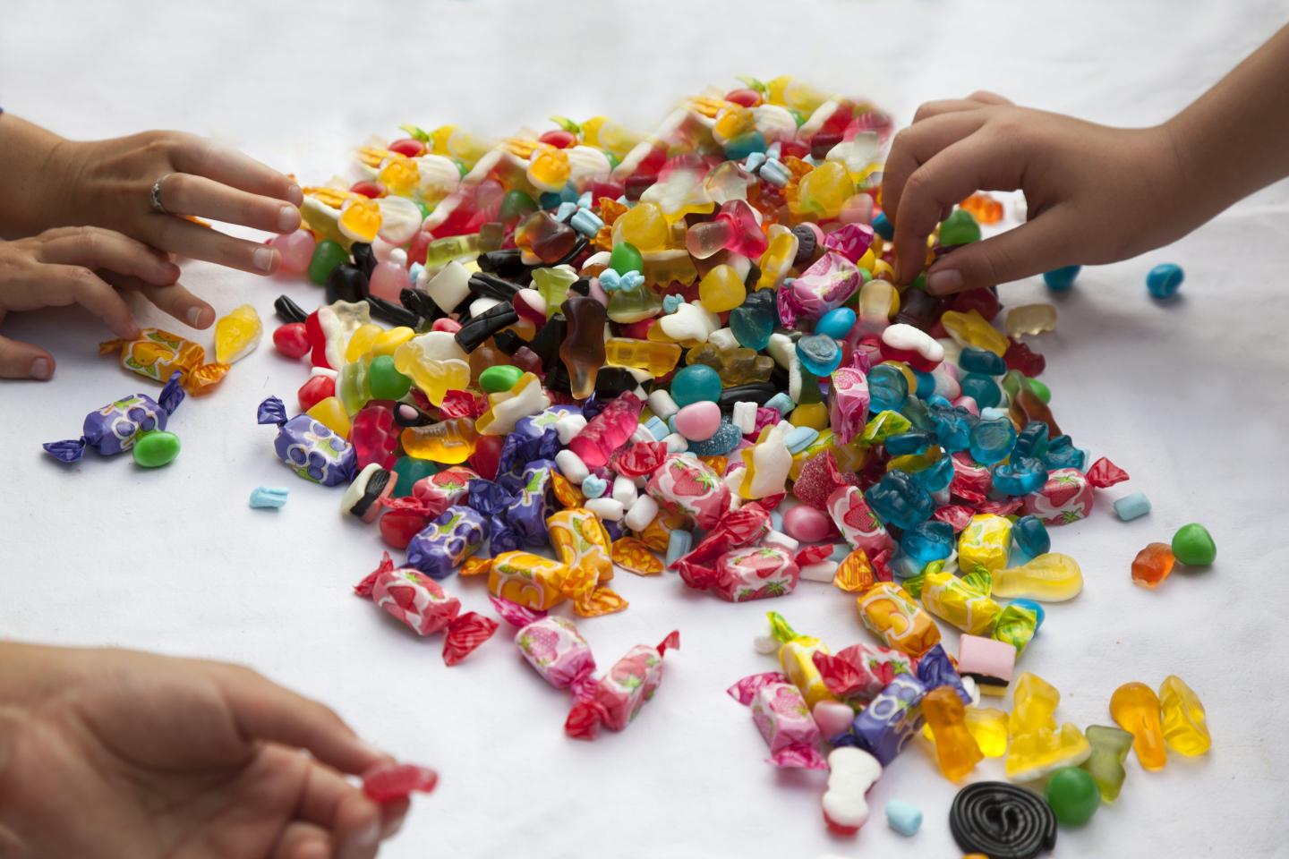 child with lots of candy