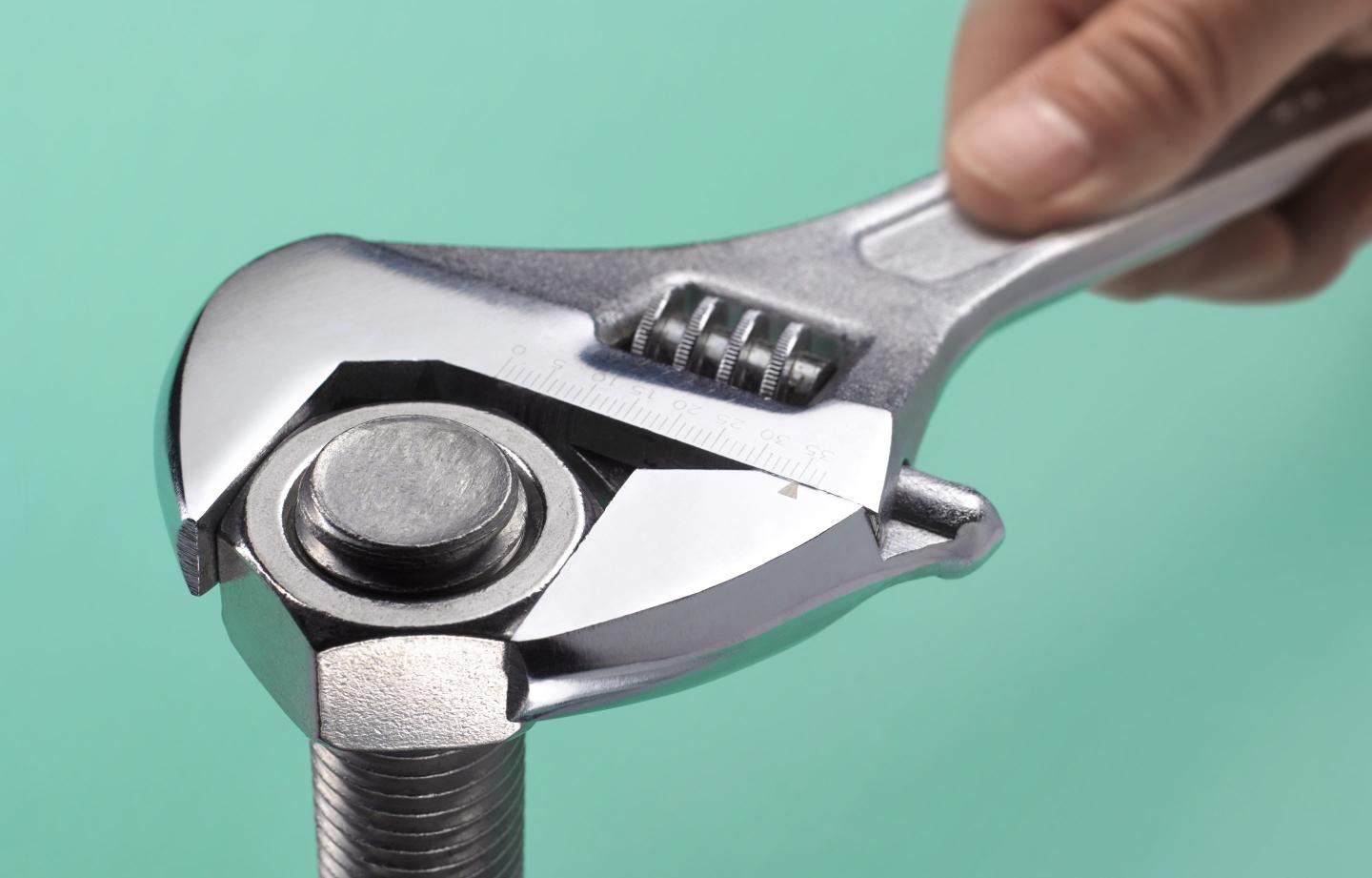 Adjustable spanner and bolt close up