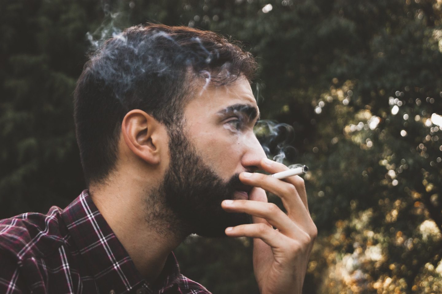 Young Man Smoking Outdoors