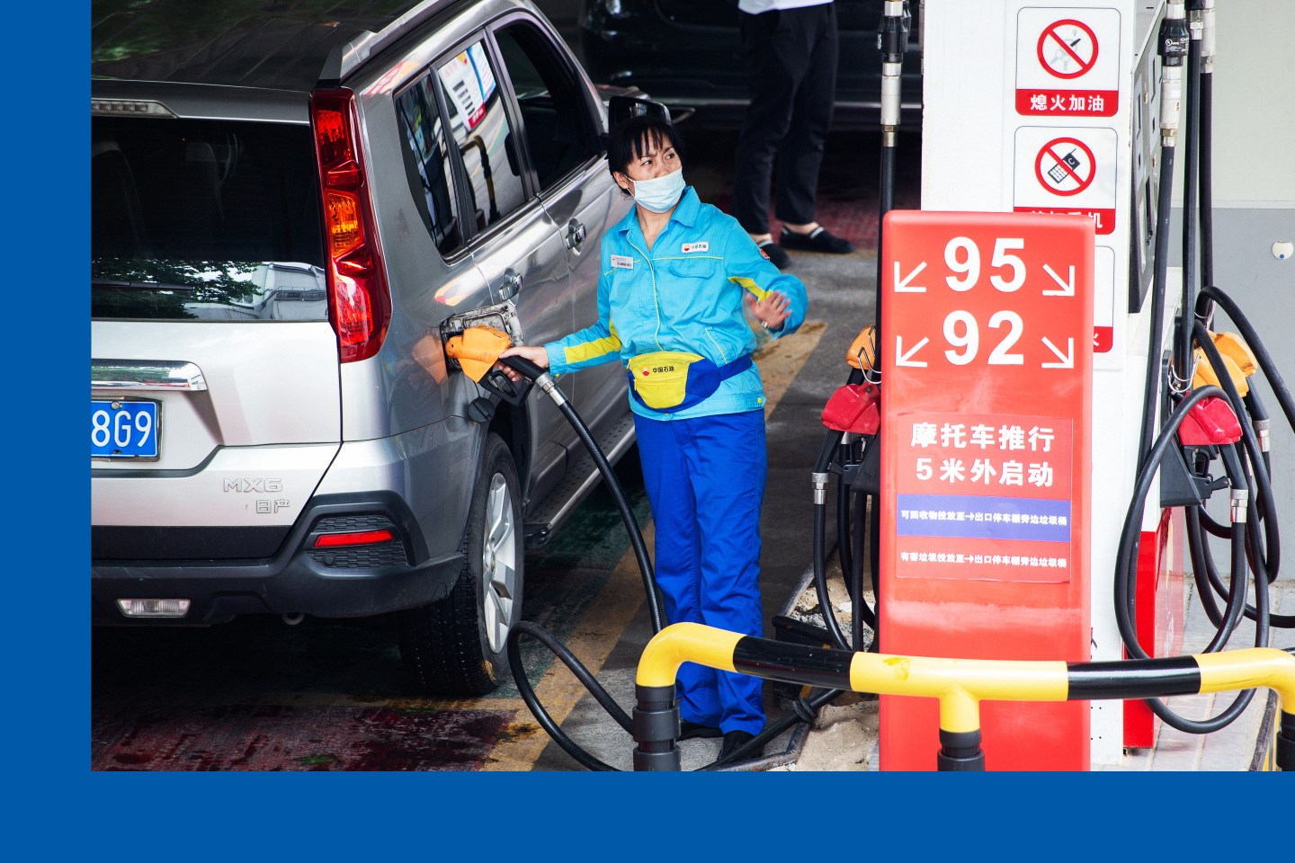 An employee refuels a vehicle at a gas station of China National Petroleum Corporation on June 28, 2022.