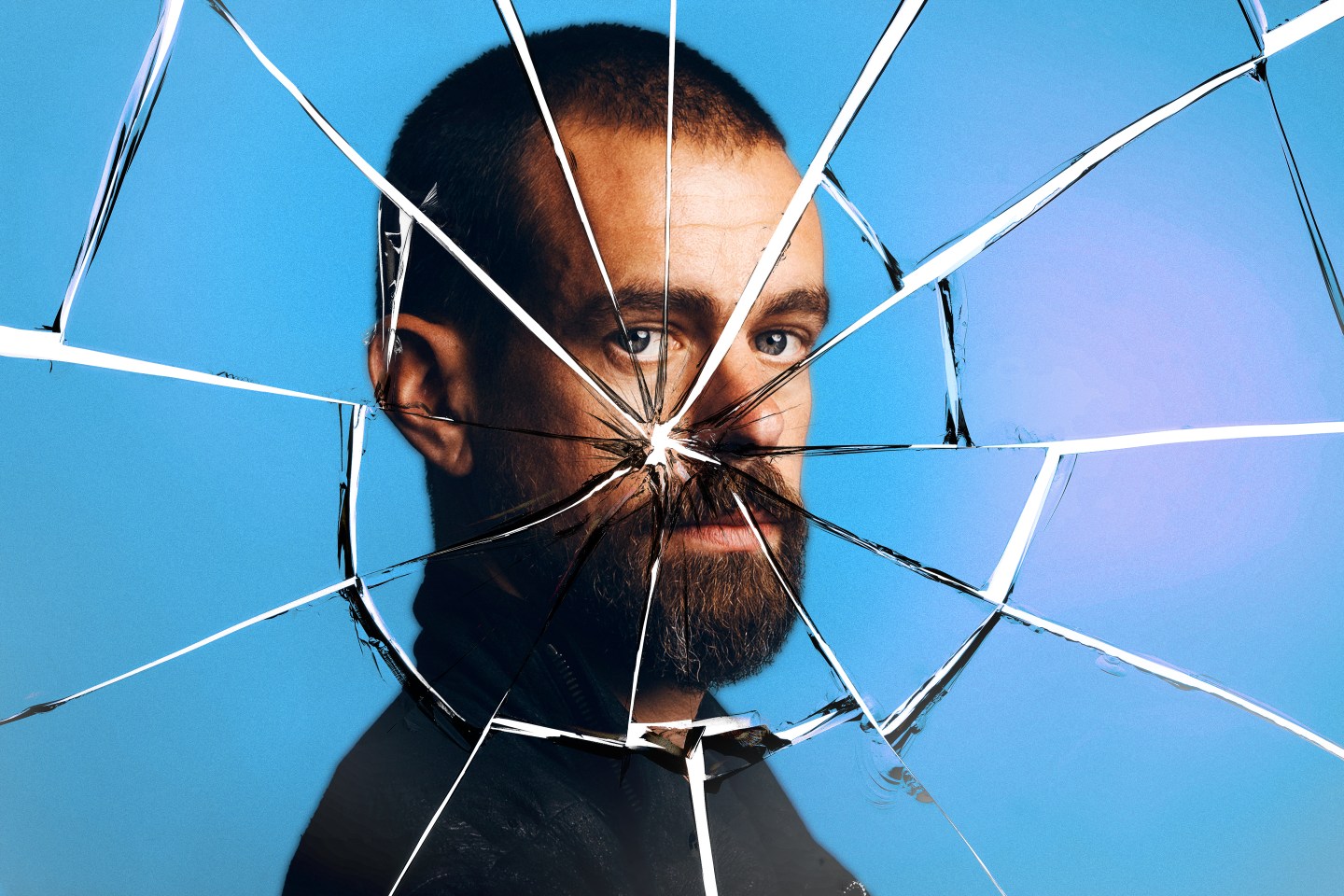 Photo illustration of Jack Dorsey behind cracked glass.