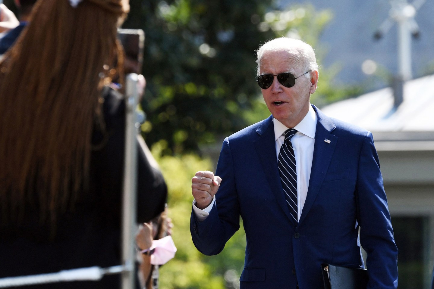 US President Joe Biden greets guests as he arrives on the South Lawn of the White House in Washington, DC, on August 24, 2022.