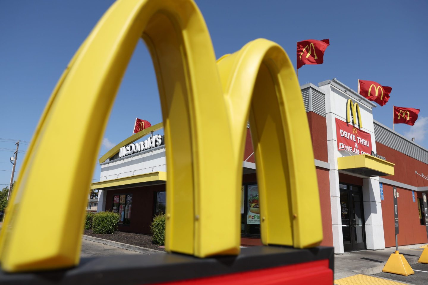 The golden arches are seen in front of a McDonald's restaurant