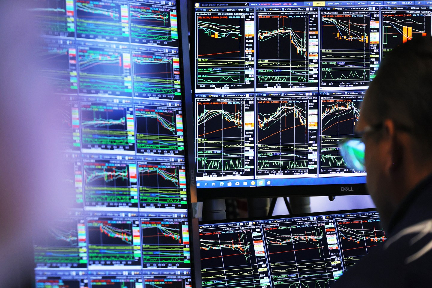Stock boards showing zig zags at the New York Stock Exchange.