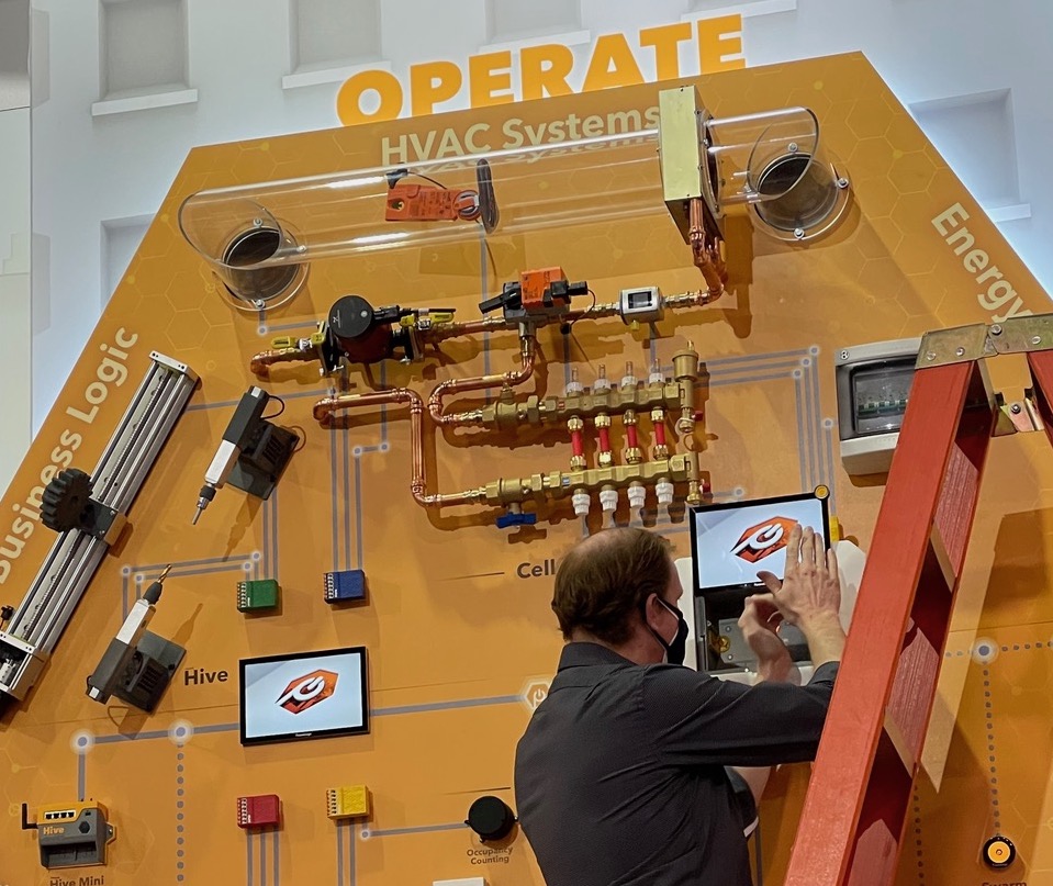 CTO and co-founder Jeremy Fillingim disassembling the PassiveLogic booth at AHR 2022 in Las Vegas, Nevada.