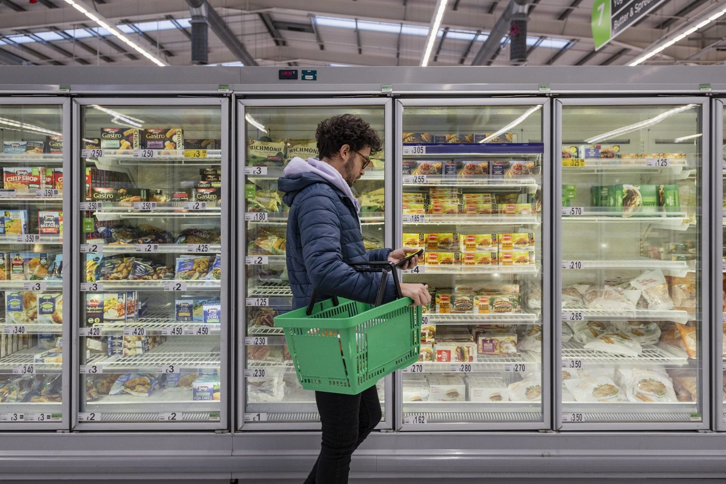 A man shops in a supermarket.