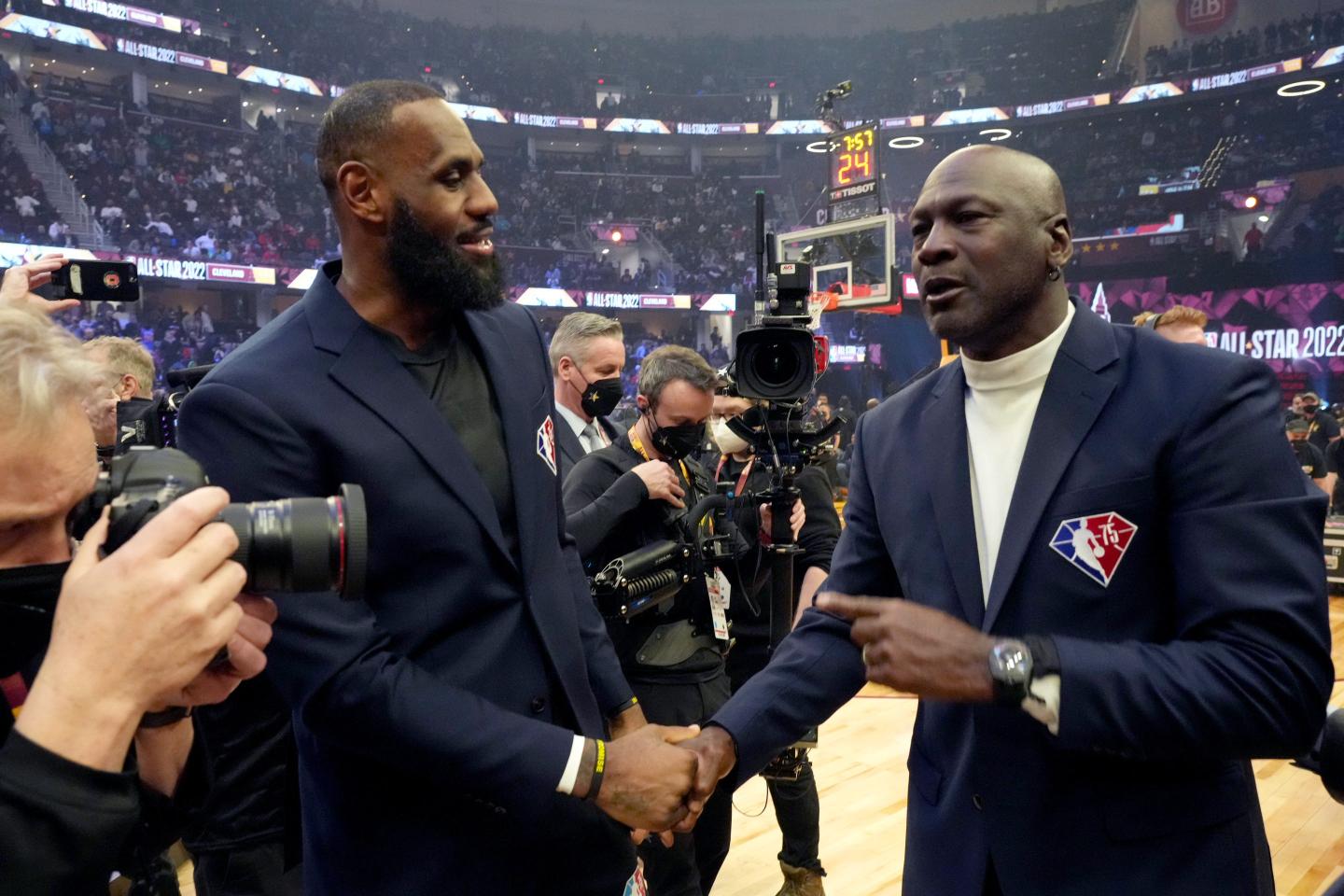 CLEVELAND, OHIO - FEBRUARY 20: (L-R) LeBron James and Michael Jordan attend the 2022 NBA All-Star Game at Rocket Mortgage Fieldhouse on February 20, 2022 in Cleveland, Ohio.